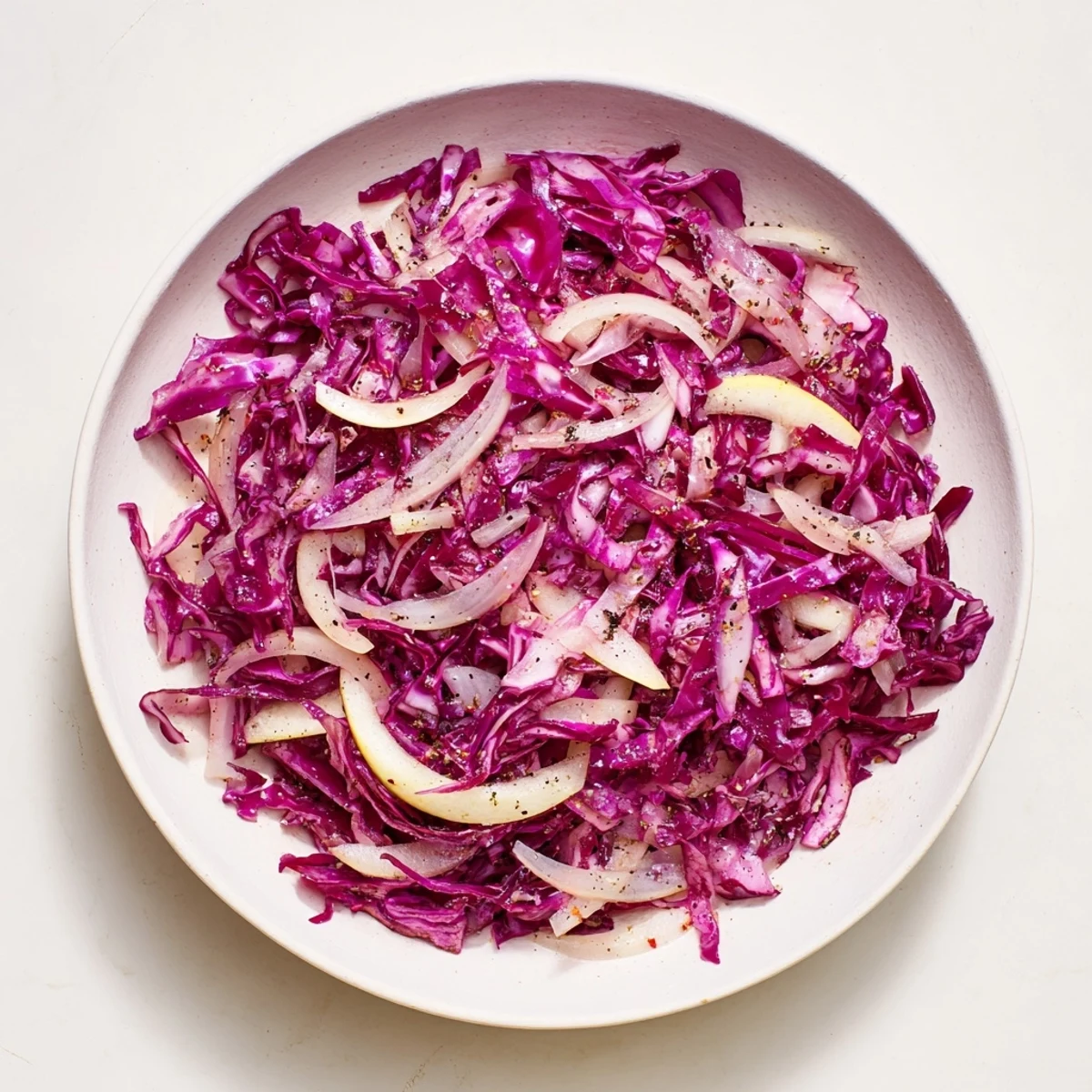 This German Bavarian red cabbage and apple side dish features glossy, softened apples and cabbage, inviting you to taste.
