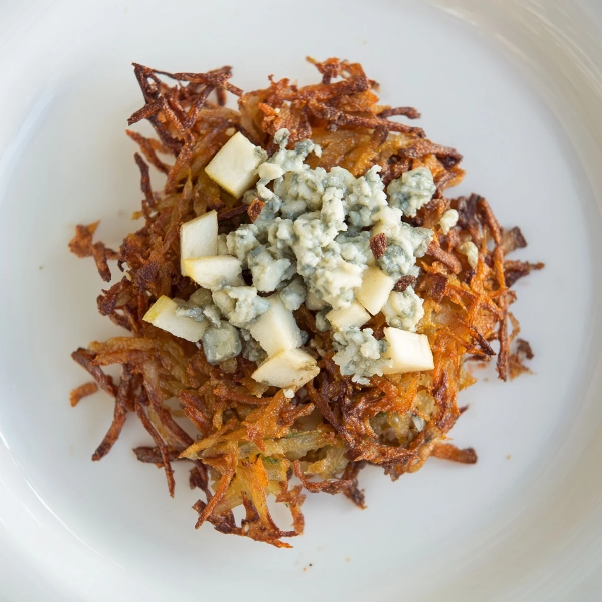 Golden Budget Potato Pancakes with Gorgonzola-Apple Compote, served piping hot with creamy toppings.