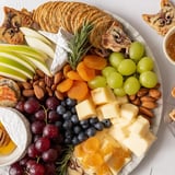 This Cozy Forest Animal Board displays tasty cheese, meats, and crackers, creating a perfect snack board.