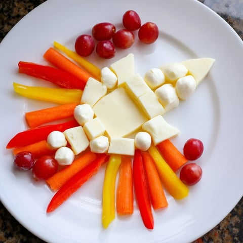 A colorful Blast Off Spaceship Snack Board with fresh veggies, cheese, and fun space-themed treats.