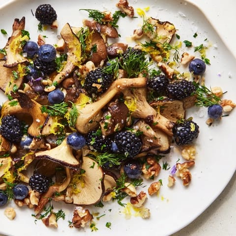 Vibrant Northwest Forest Forager salad, showcasing earthy mushrooms, berries, and a fresh herb moss.